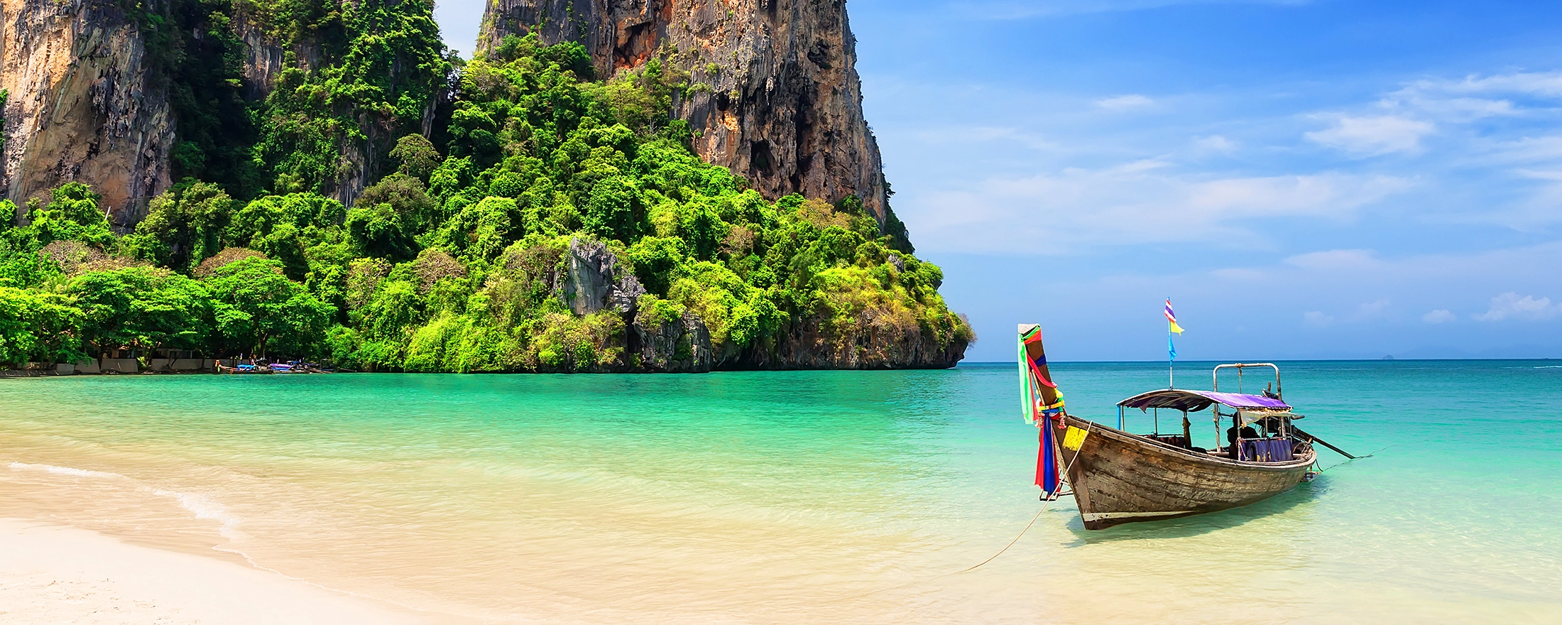 HERO_Thai-traditional-wooden-longtail-boat-and-beautiful-sand-Railay-Beach-in-Krabi-province.-Ao-Nang-Thailand_Credit_GettyImages-1011241694